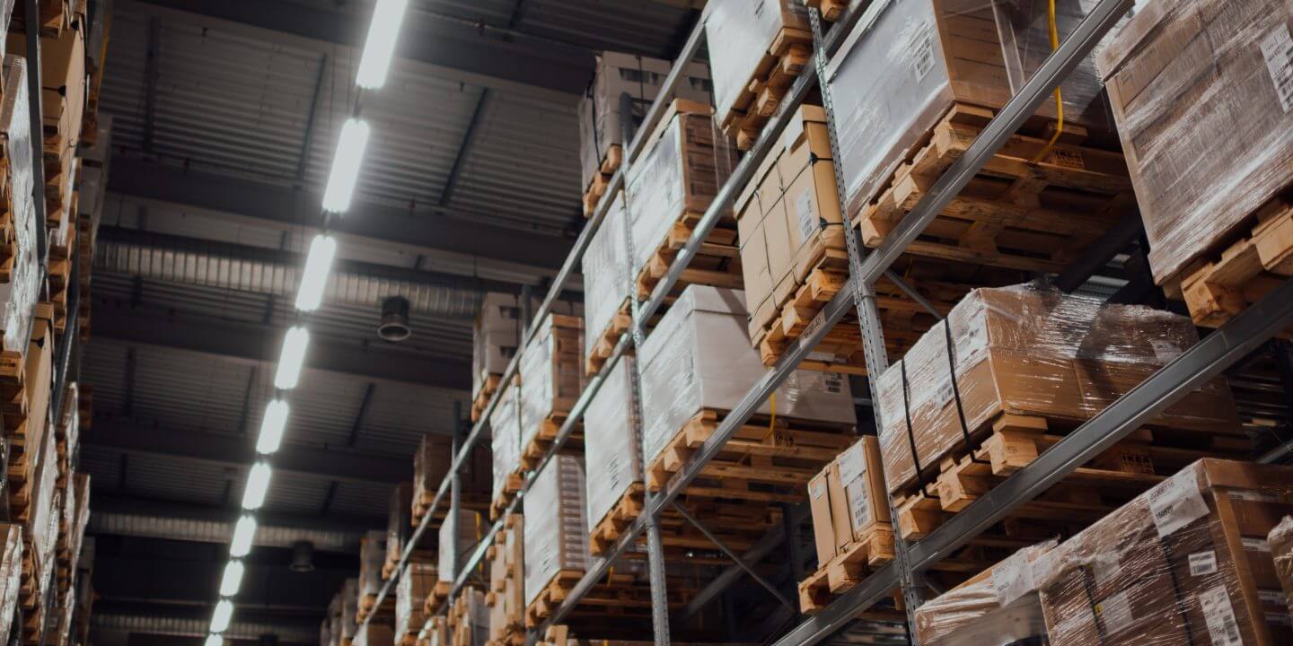 warehouse shelves with boxes on palettes