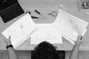 Engineering drawings on a desk